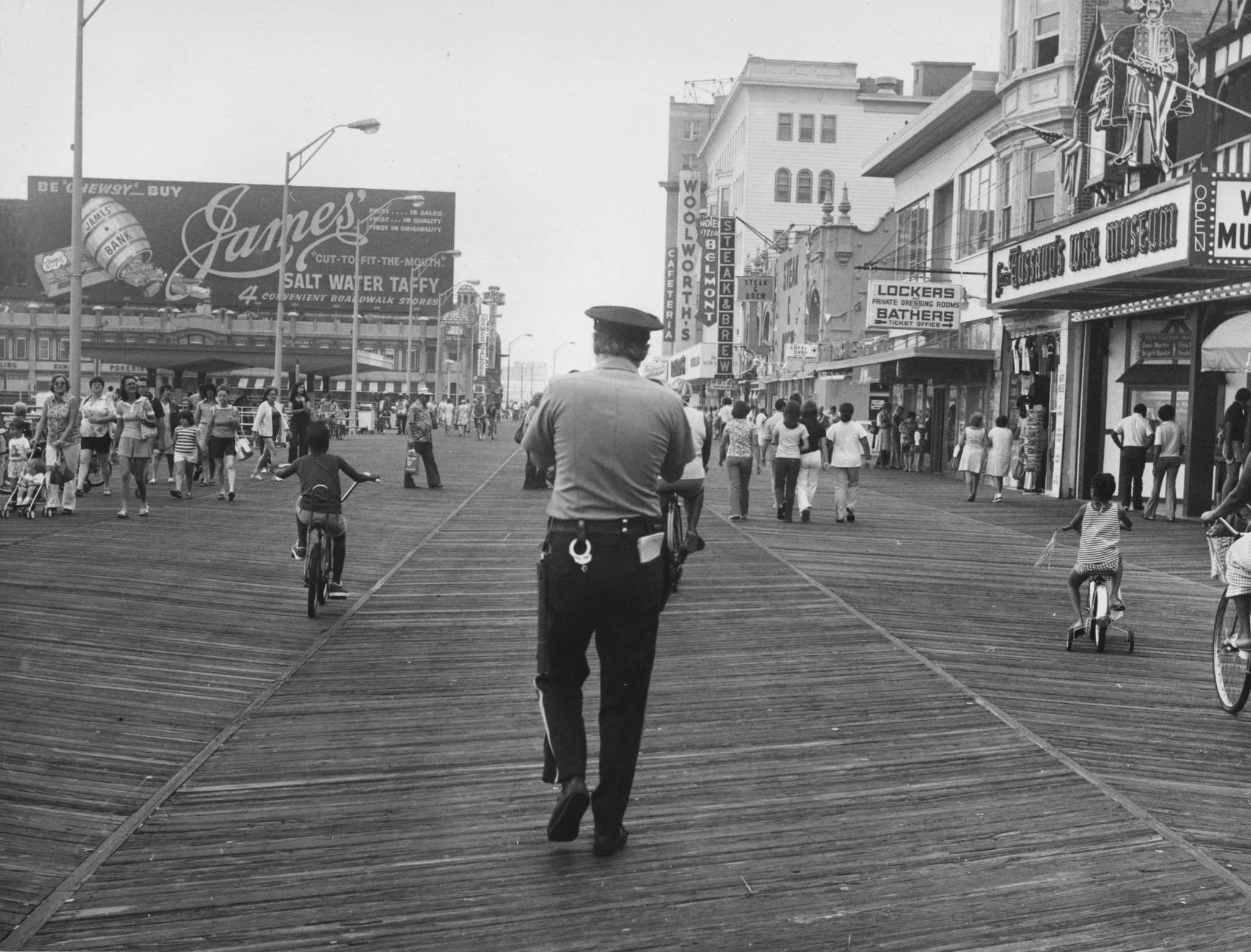 A policeman walking along the boardwalk at Atlantic City, New Jersey, 1976