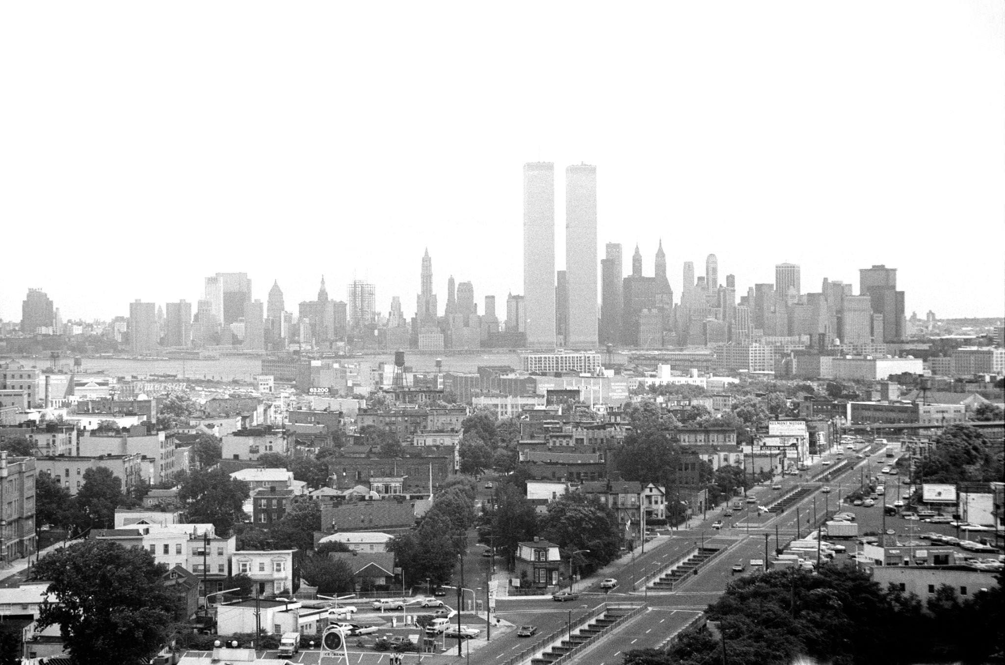 Aerial view, looking east, with the World Trade Center and the New York City skyline in the distance, of Montgomery Street in downtown Jersey City, New Jersey, 1974.