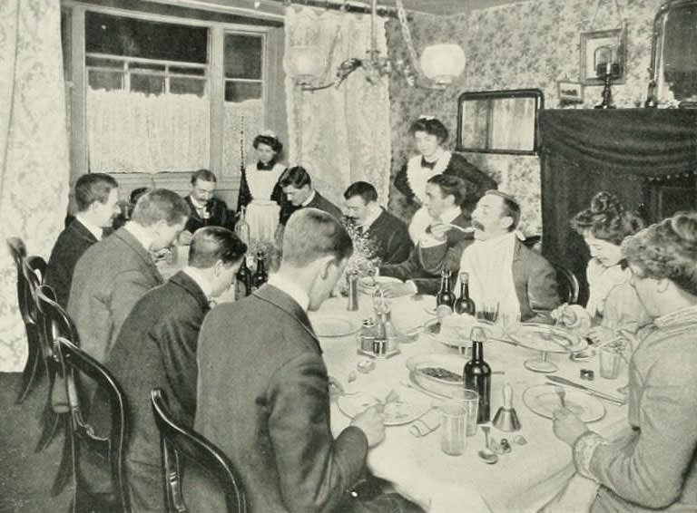 Evening dinner at a London boarding house.