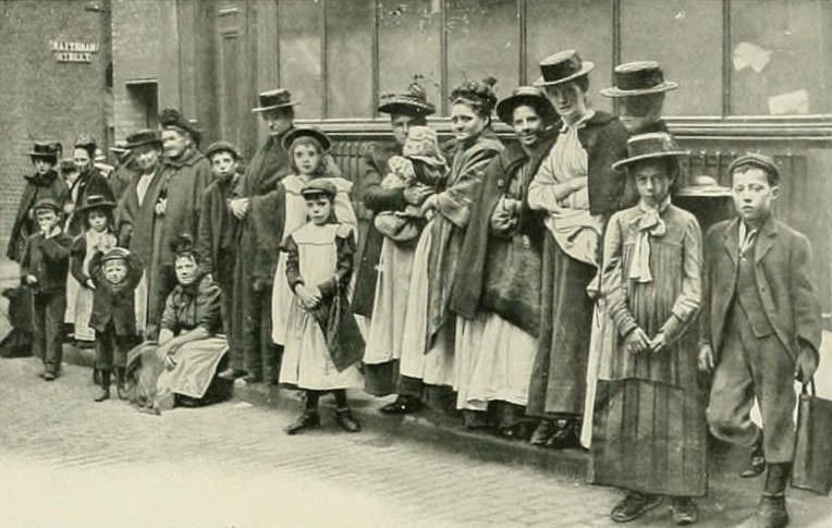 People waiting in line to buy trim-mixes of meat.