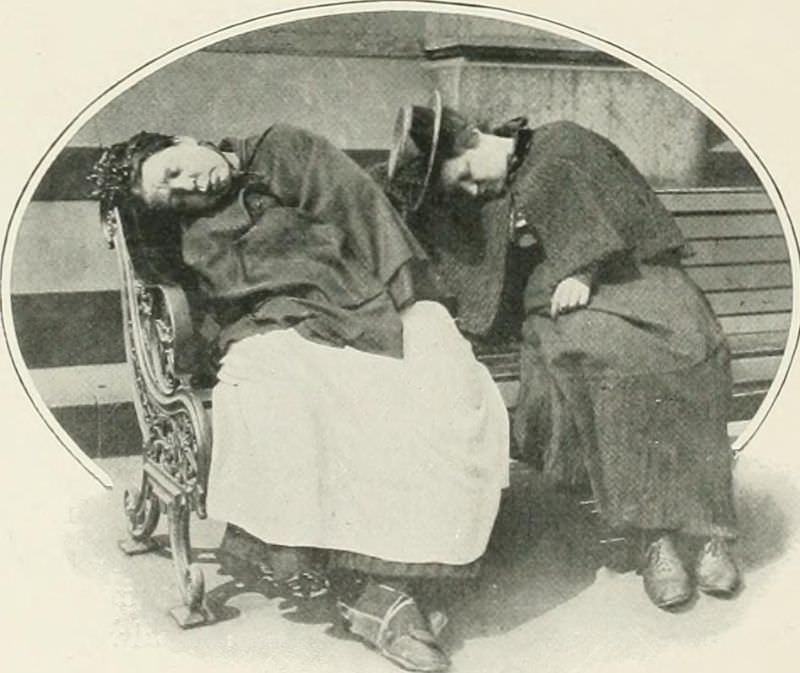 Two female ‘tramps’ sleeping in the sun at Trafalgar Square.