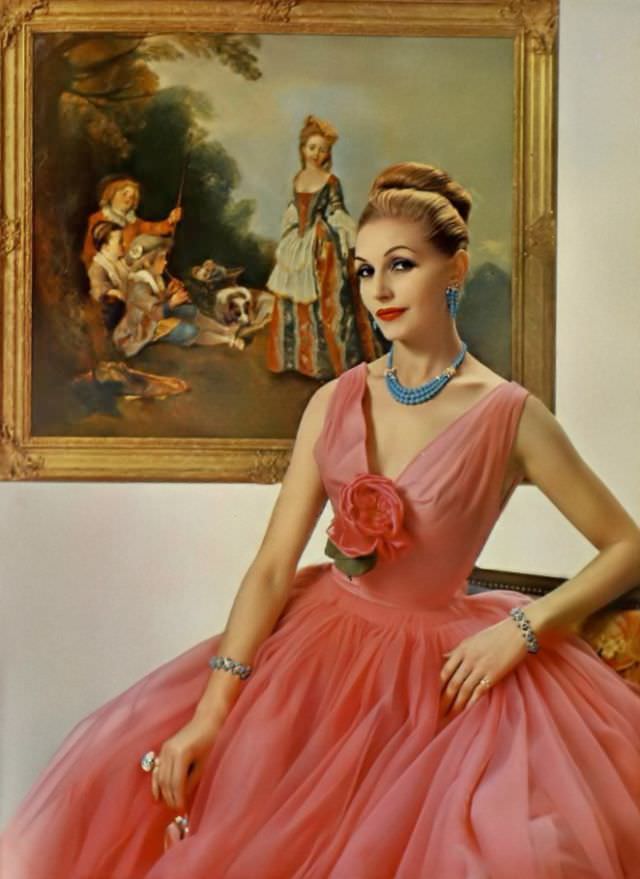 Denise Sarrault in gala evening gown of rose Cigaline de Bucol by Grès, jewelry by Sterlé, 1959