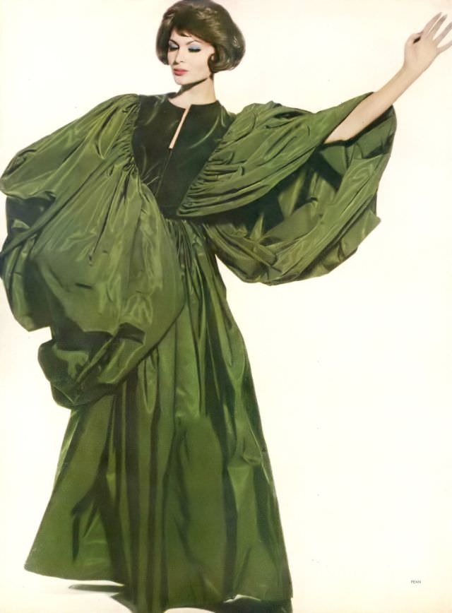 Isabella Albonico in magnificent gown with enormous wing-like sleeves of Venetian green velvet and taffeta by Grès, December 1, 1959