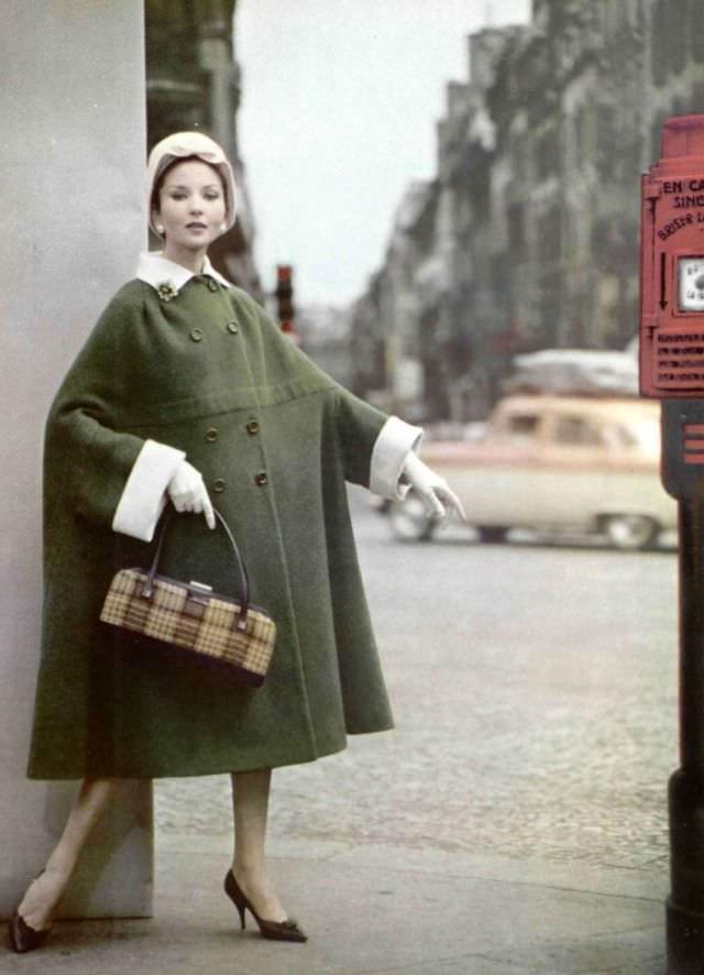 Model in cozy reversible wool coat by Grès, hat by Jean Barthet, shoes by Charles Jourdan, 1959