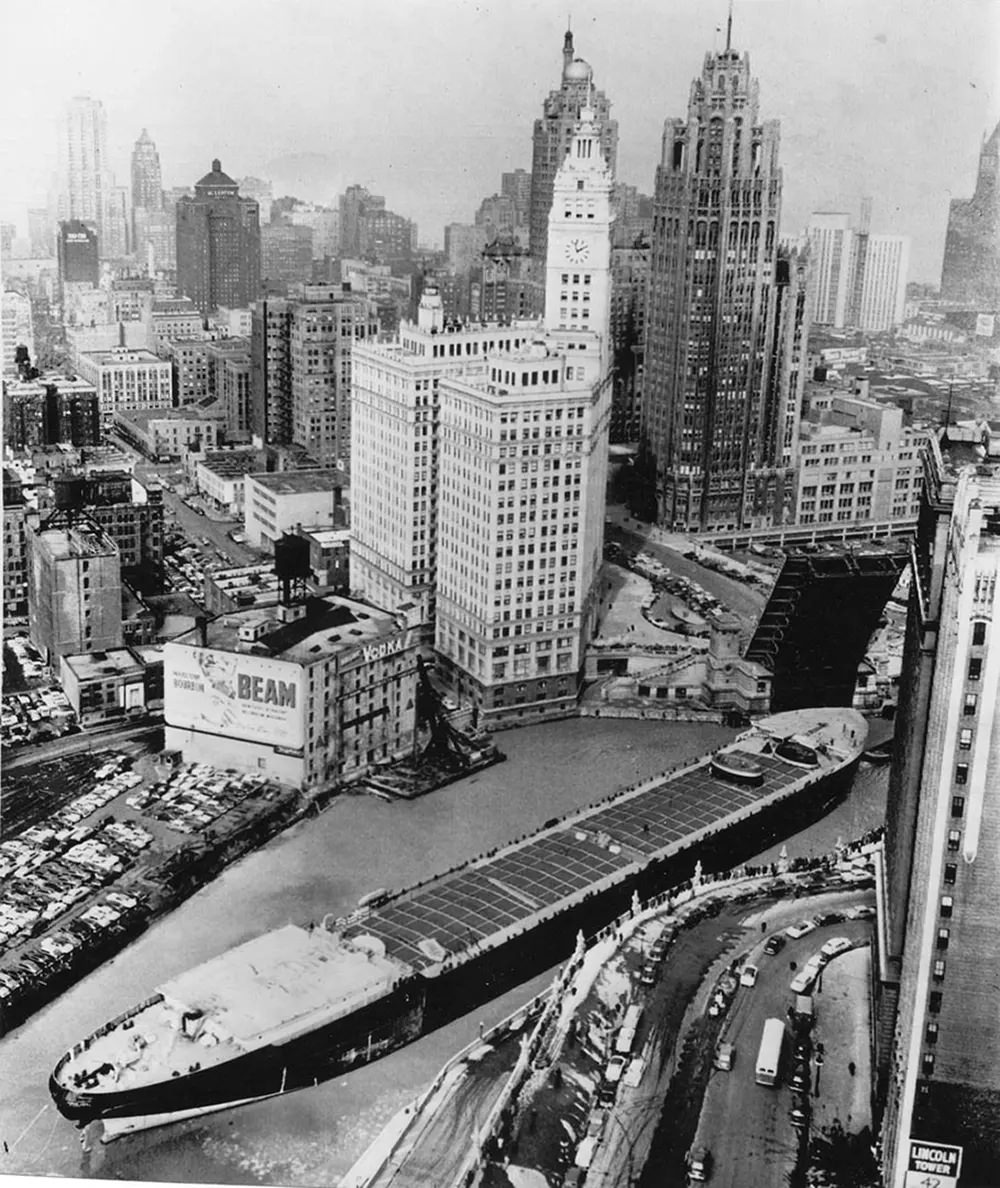 Passing through Michigan Ave. Bridge, March 6, 1953. At the time, it was the largest vessel to ever travel the Mississippi River and Illinois waterways.