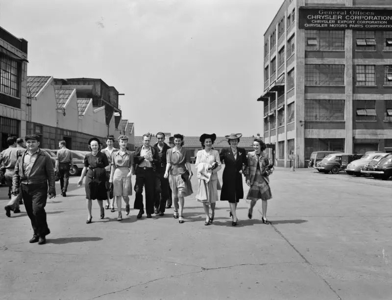 Workers coming out of the Highland Park Chrysler plant, Detroit, Michigan, spring 1942.