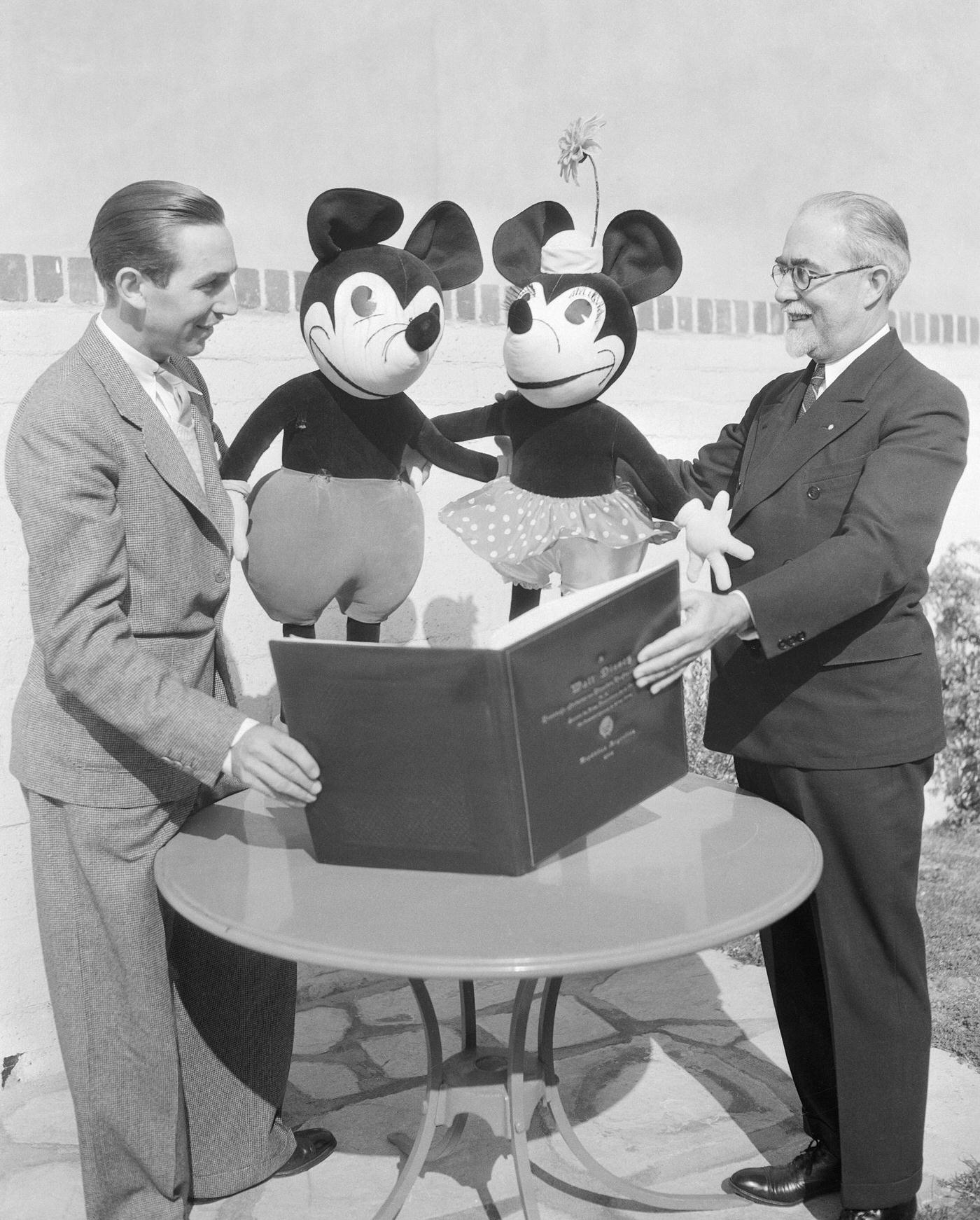 Walt Disney Sharing Diploma with Mickey and Minnie Mouse