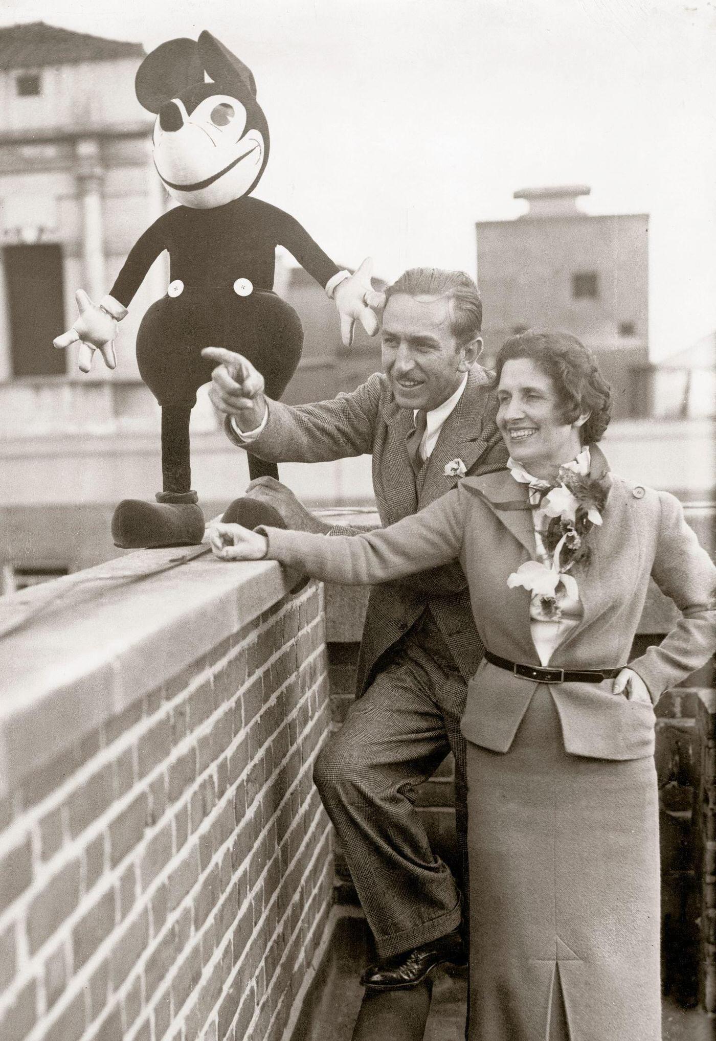 Walt Disney with his wife and his and Mickey Mouse, at his arrival in New York, 1935