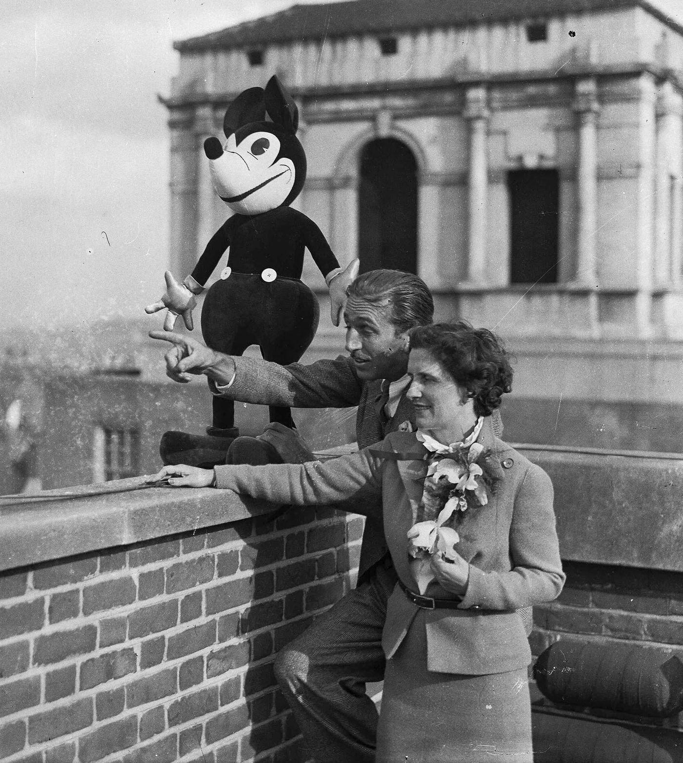 Walt Disney and his wife, Lillian with Mickey Mouse on the roof of their London Hotel, 1935