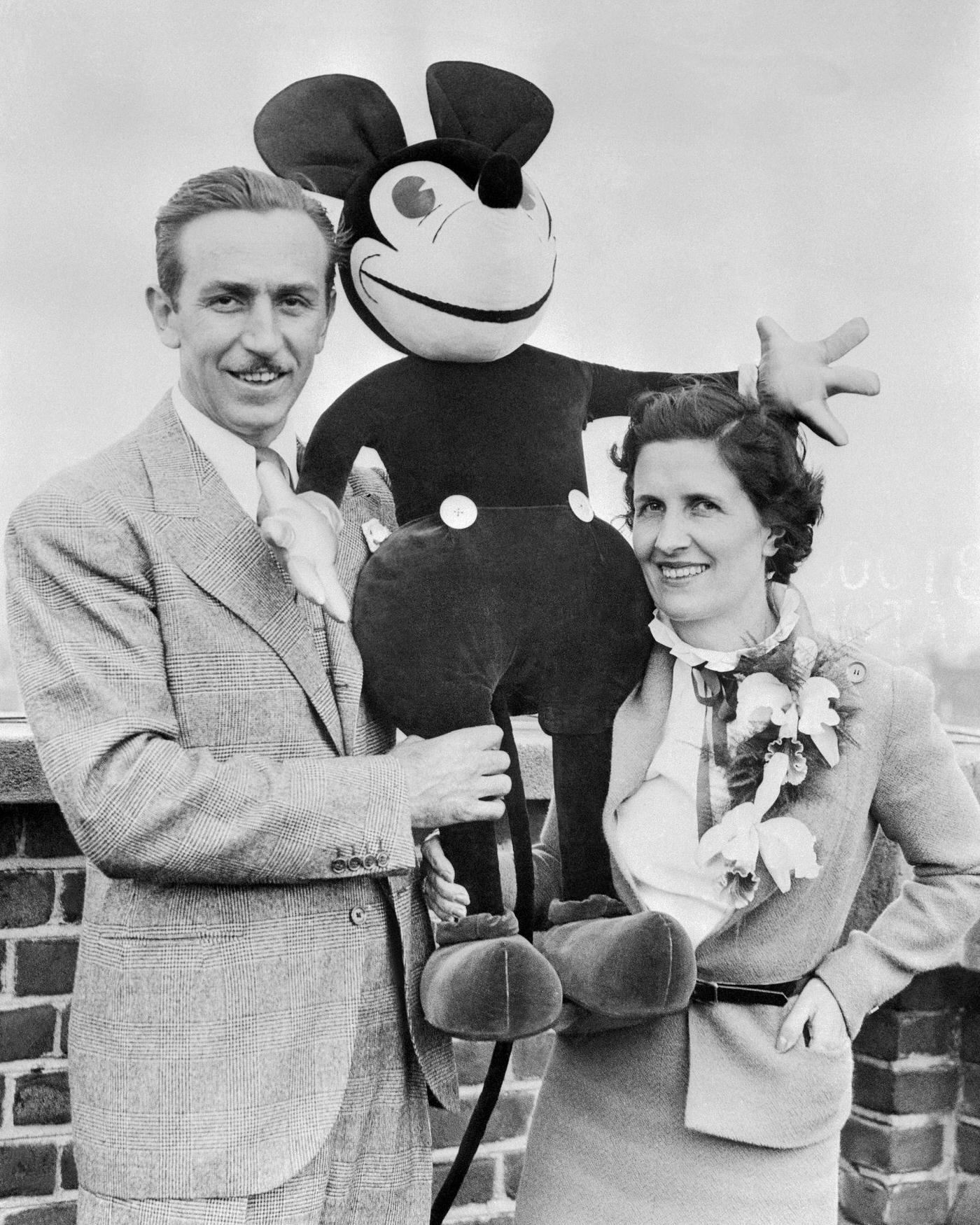 Walt and Mrs. Disney Standing with Stuffed Mickey Mouse