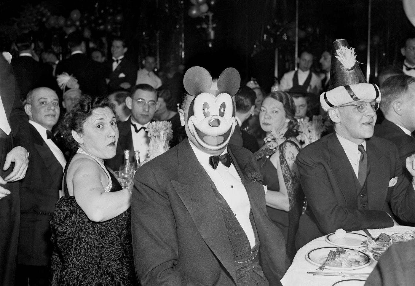 That's J. Edgar Hoover behind the Mickey Mouse mask at a New, 1937