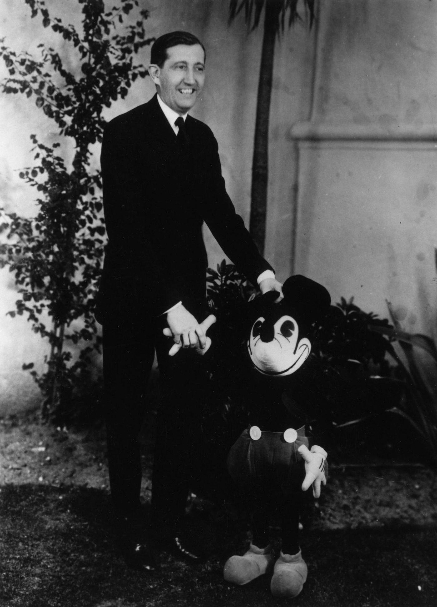 American film producer David O. Selznick with Mickey Mouse.