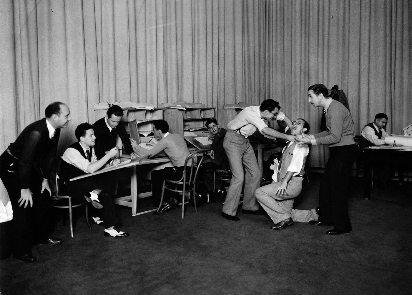 Disney with his employees in a motion study for drawn by a Mickey Mouse Scene , 1938