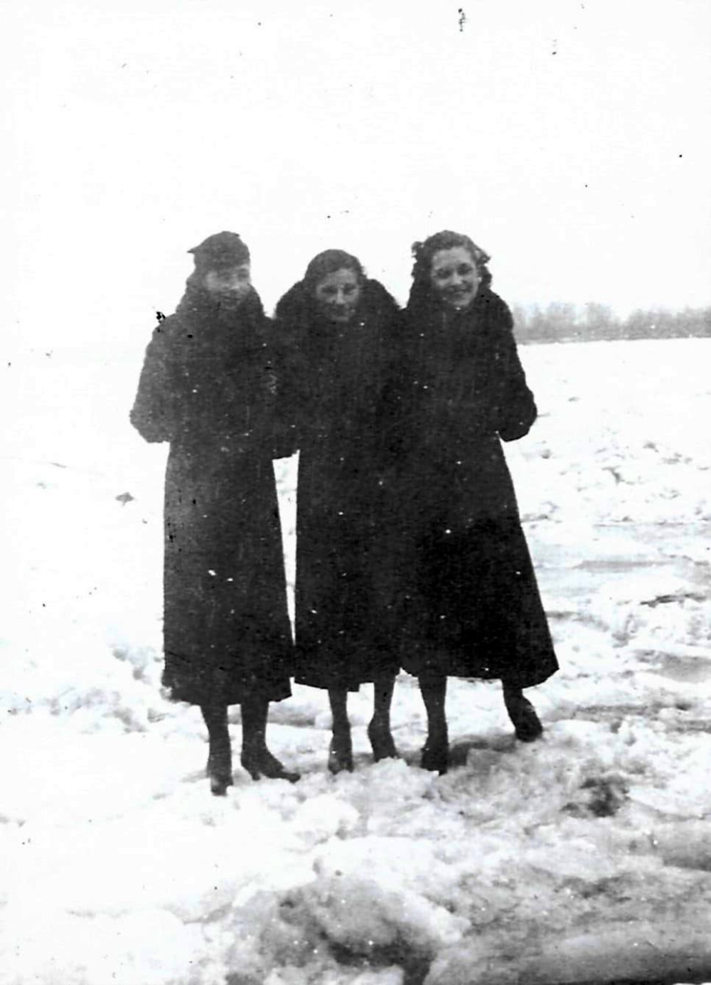 Three women standing on the frozen Mississippi River on Feb. 15, 1936.