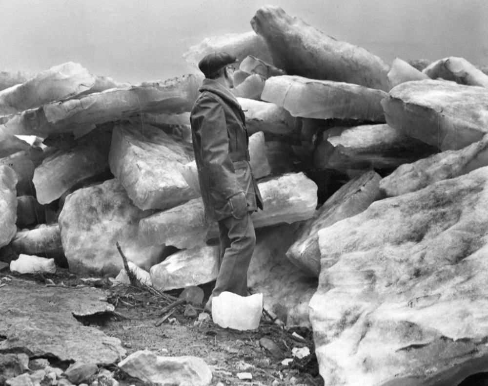 A man examines some of the chunks of ice along the St. Louis riverfront on Feb. 26, 1936, after the ice jam across the Mississippi river began breaking up.