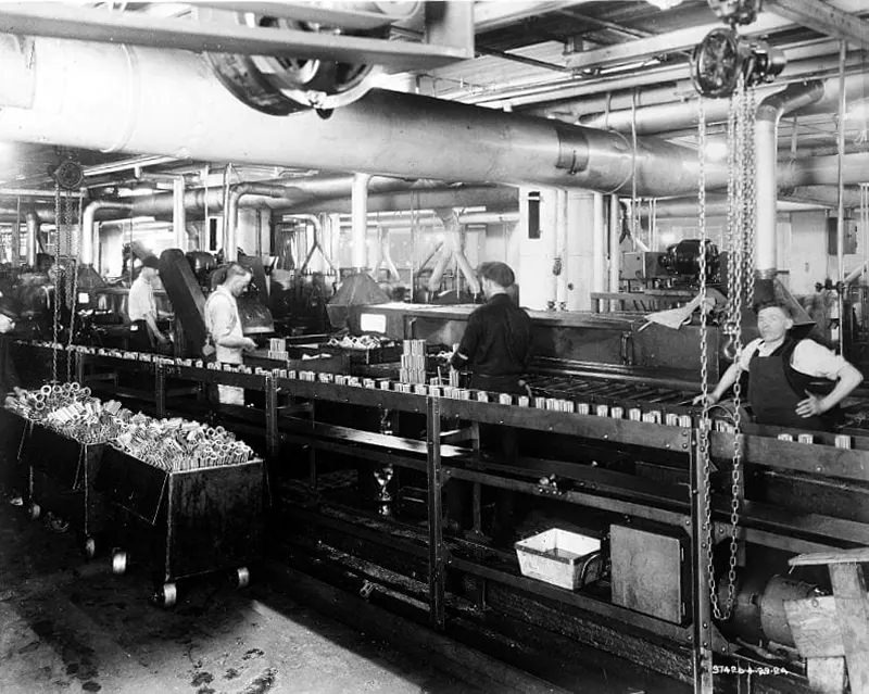 Factory workers on Ford assembly line for bearings, 1924.