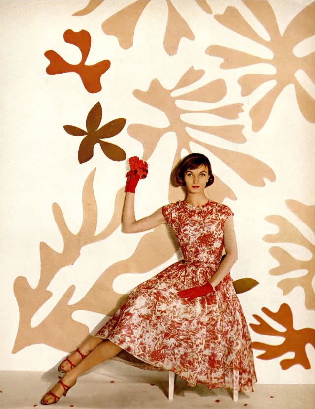 Evelyn Tripp in lovely summer dress of sheer organdy print over taffeta by Mollie Parnis, shoes by De Liso Debs, Harper's Bazaar, May 1955