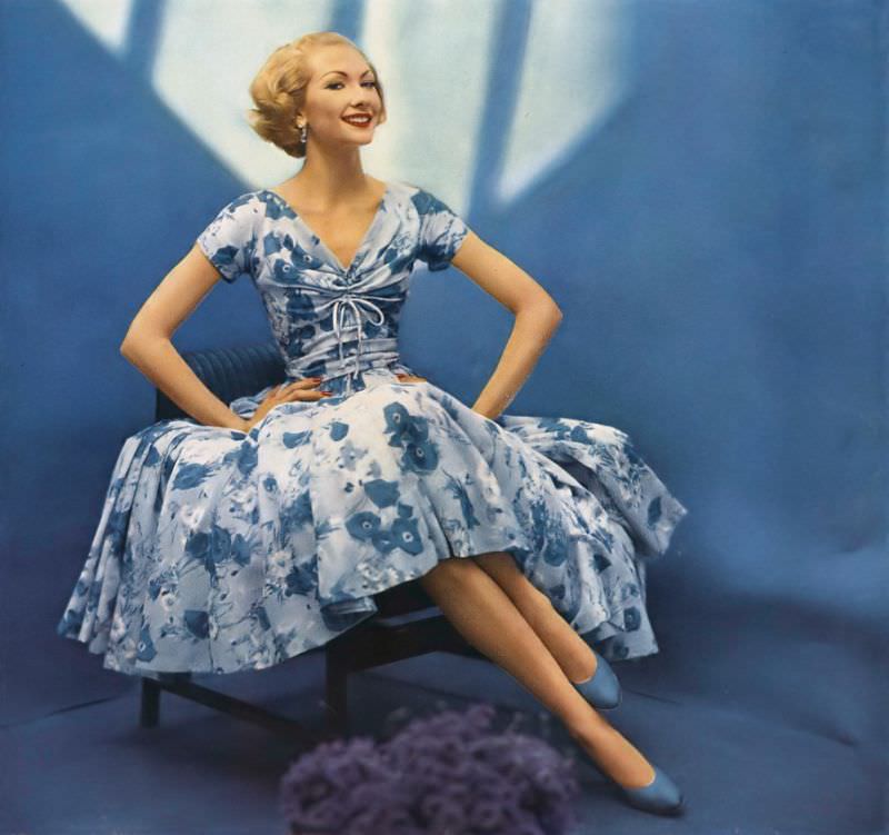 Jessica Ford in blue floral print Wamsutta Supervoile dress by Mollie Parnis, Wamsutta fabric ad, Vogue, December 1, 1956