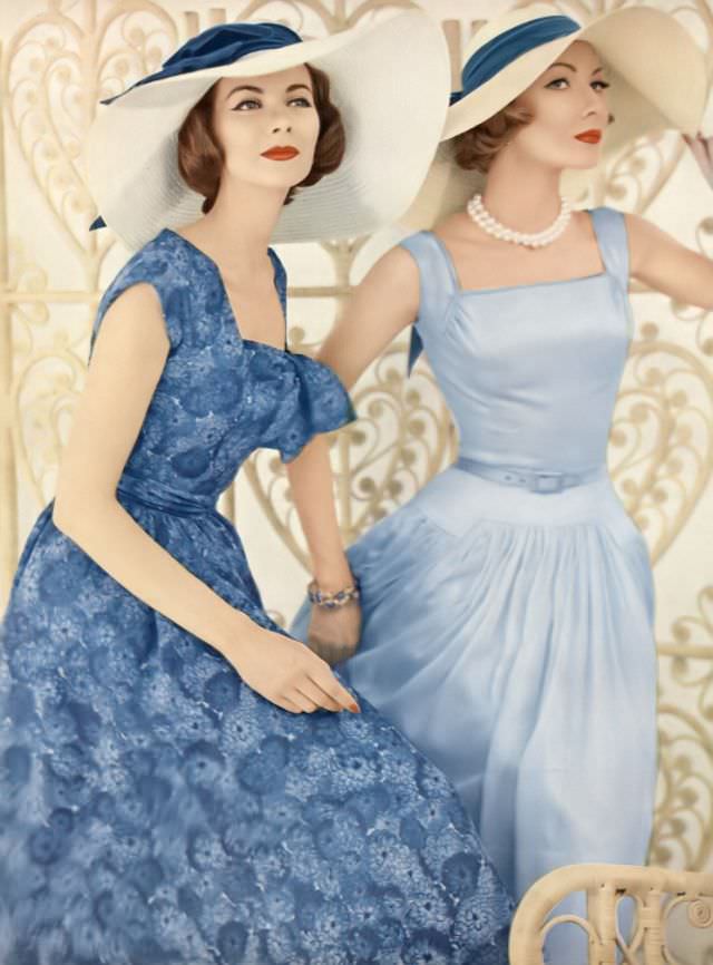 Joan Friedman and Jessica Ford in pretty thin-as-air cotton shiffon dresses by Mollie Parnis, hats by Emme, December 1, 1956