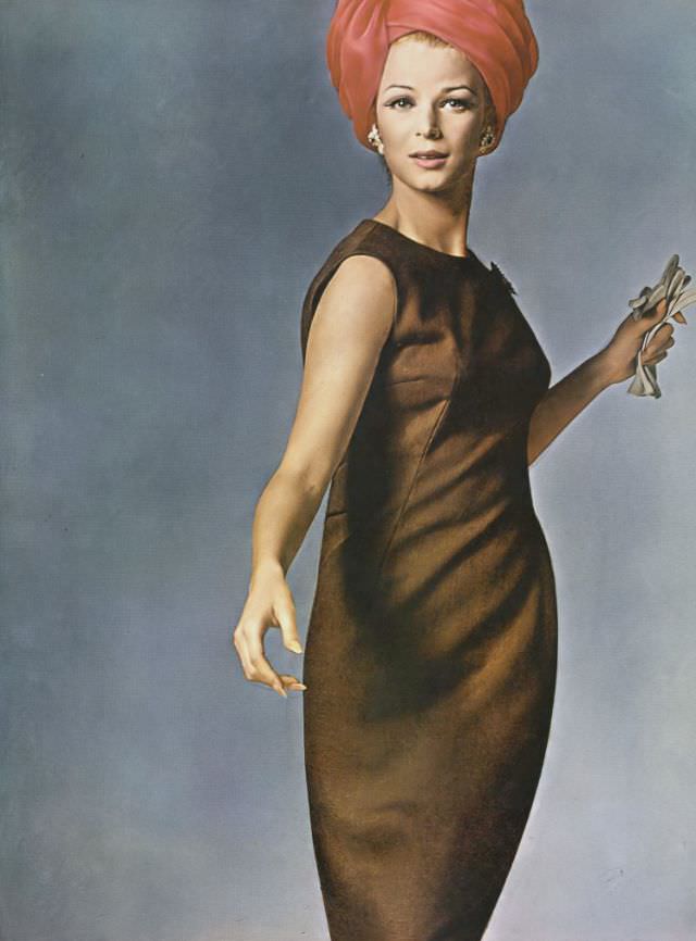 Anne de Zogheb in sleeveless brown linen skimmer, half-belted in back, by Mollie Parnis, earrings by Schlumberger of Tiffany's, May 1, 1962