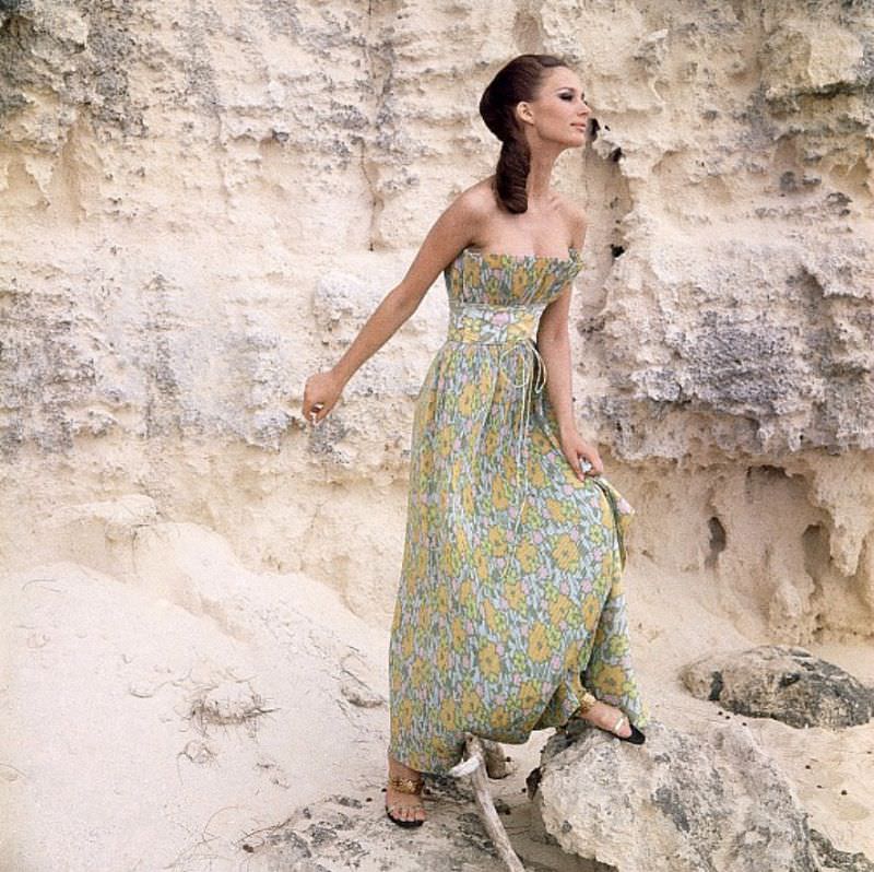 Brigitte Bauer in a pin-pleat evening with fan-pleated top in pale floral print by Mollie Parnis, Vogue, April 15, 1964