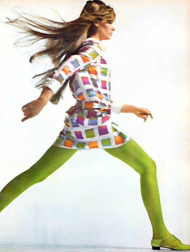 Françoise Hardy in silk belted shirtdress with bright colors blocked out like ships' flags on a field of white by Mollie Parnis, shoes by Golo, Vogue, March 1, 1967