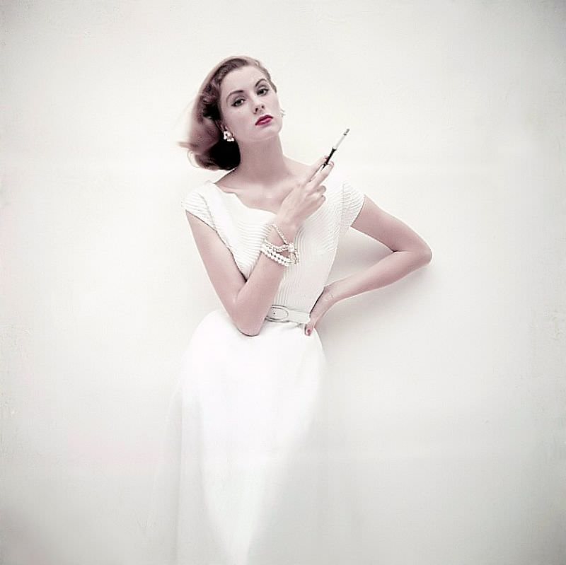 Suzy Parker in a summer dress of white linen by Mollie Parnis, February 1952
