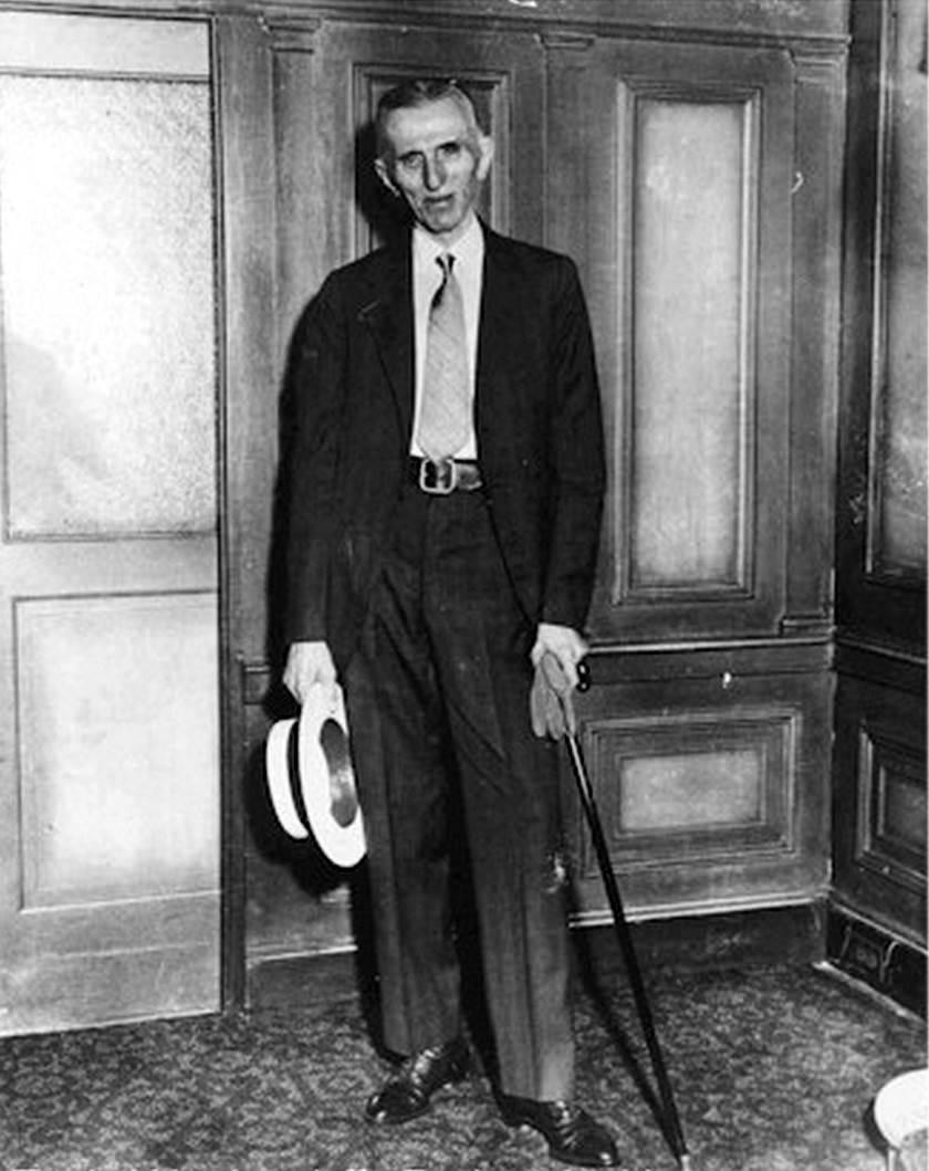 Nikola Tesla standing next to his suite at the Hotel New Yorker, circa 1934.
