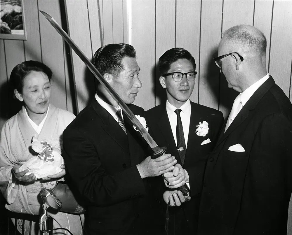 Nobuo Fujita presents his family’s Samurai sword to Brookings, Oregon in 1962.