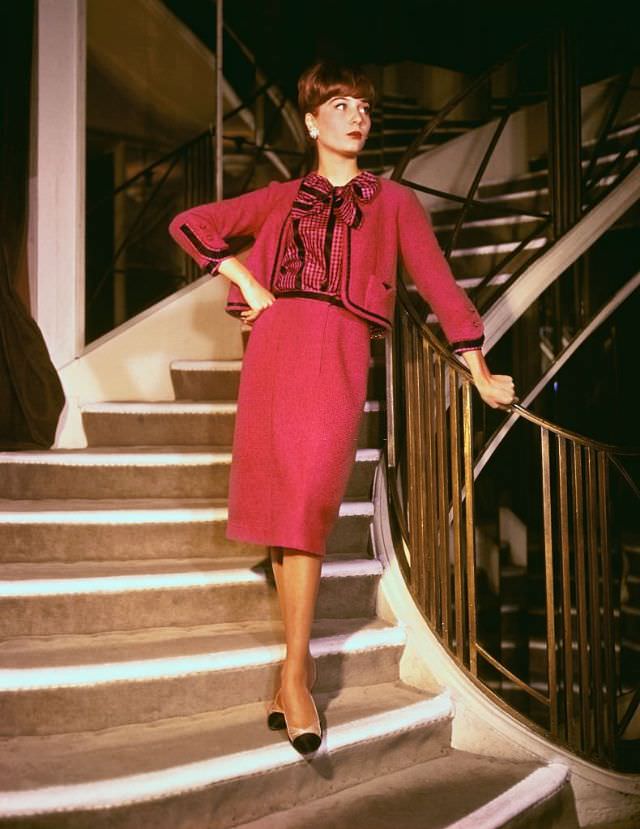 Orange satin cocktail dress by Yves St. Laurent of the House of Dior. Fall-Winter 1958-1959.