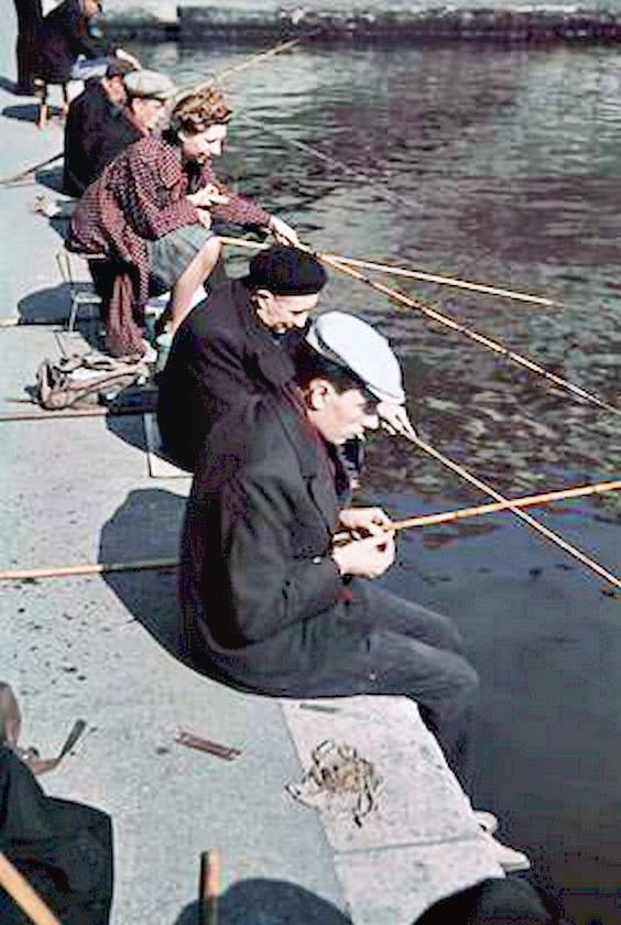 Parisians are shown fishing in the Seine.