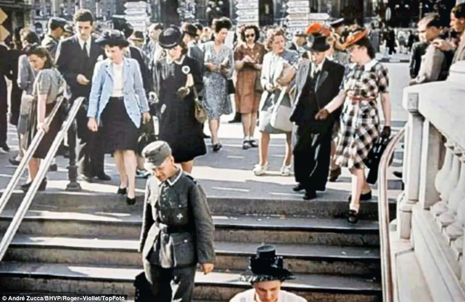 Historians say images such as this one of a Nazi soldier walking freely with Parisians was designed to show the world France was happy under occupation.