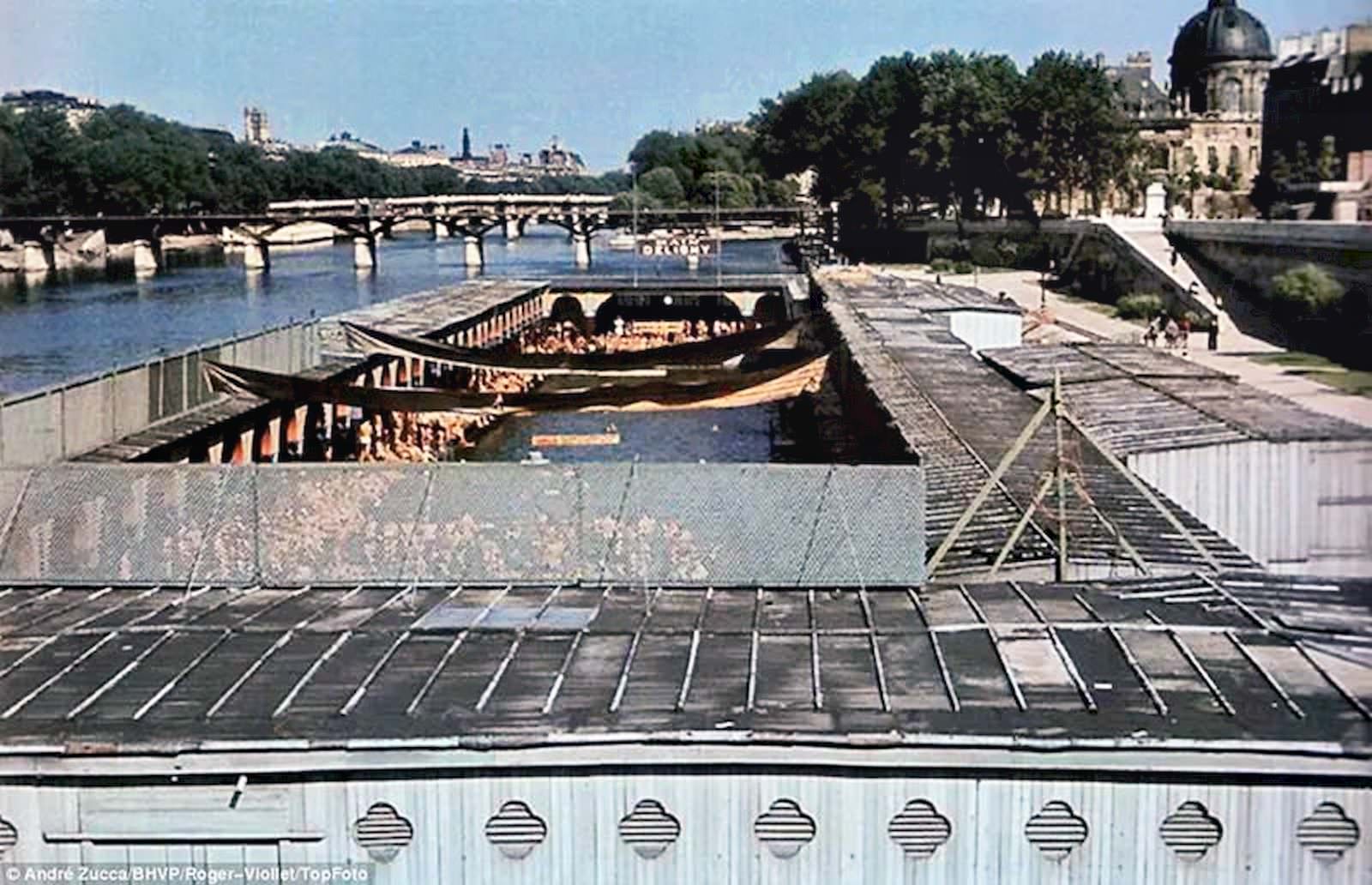 A part of the Seine is pontooned off into a swimming pool, which is filled with hundreds of Parisians grabbing a chance to cool off in the summer heat.
