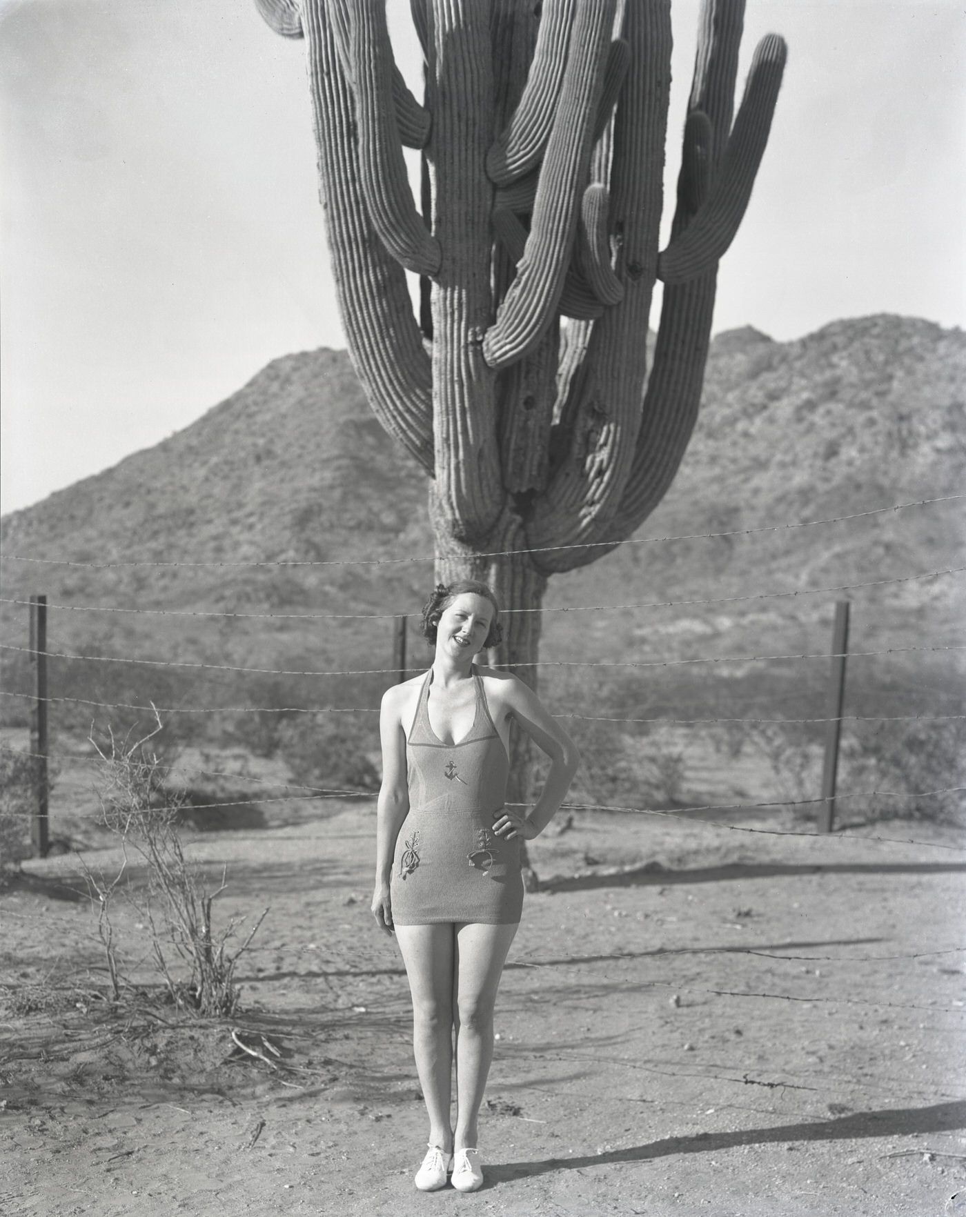 Camelback Inn Guest in Bathing Suit in Front of Cactus, 1930s