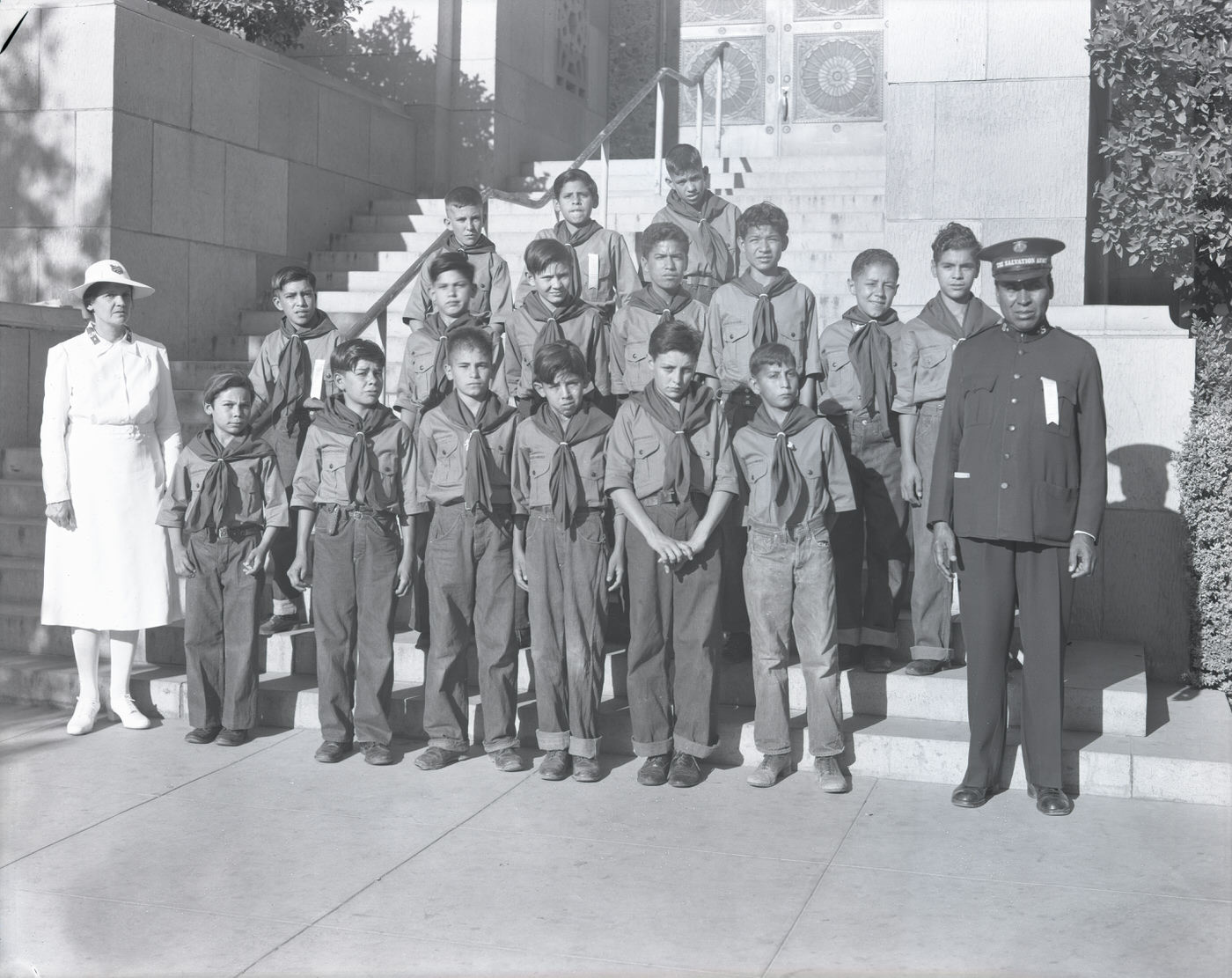 Man, Woman, and Male Salvation Army Scouts on Steps, 1943