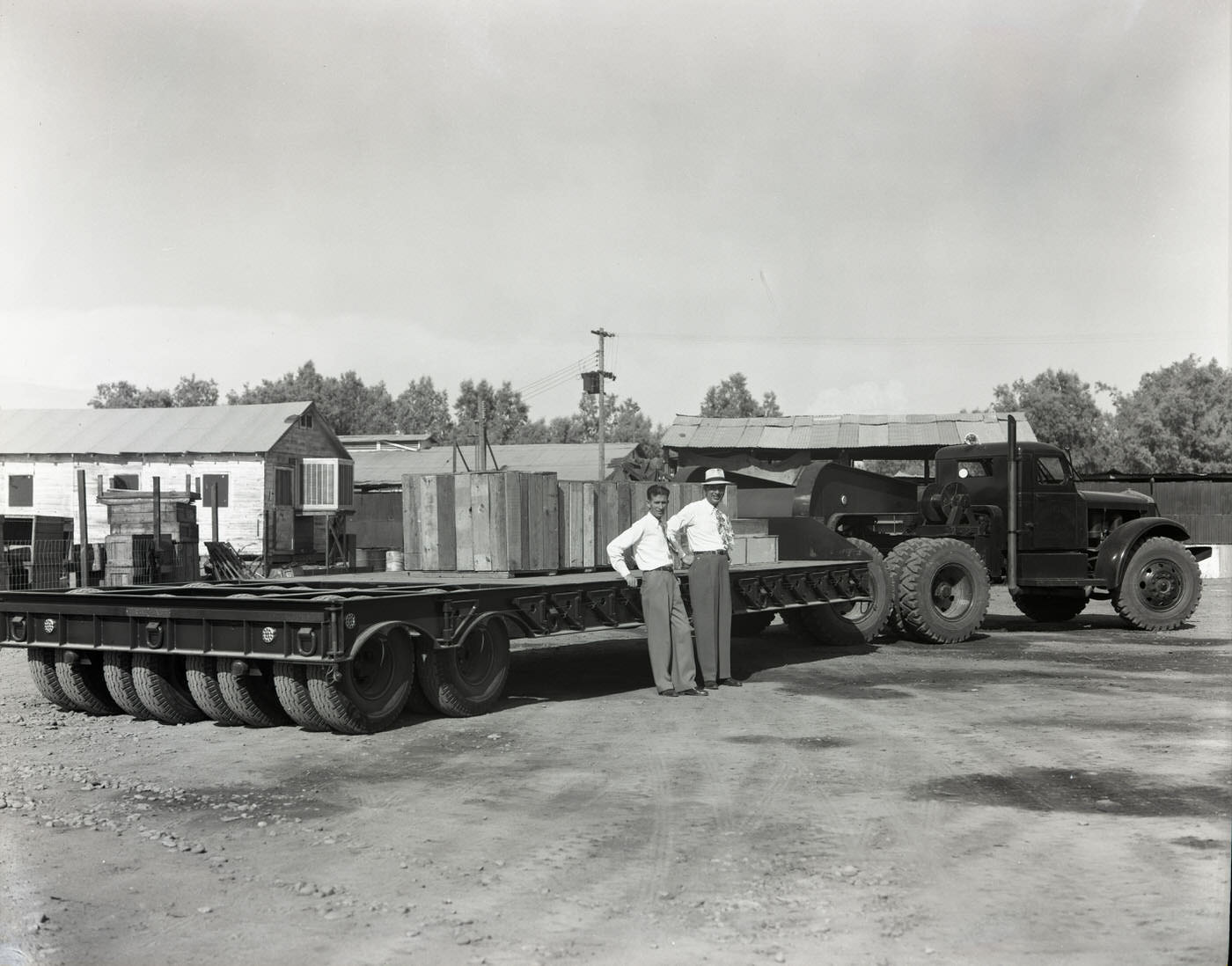 Men Standing by Truck, 1945