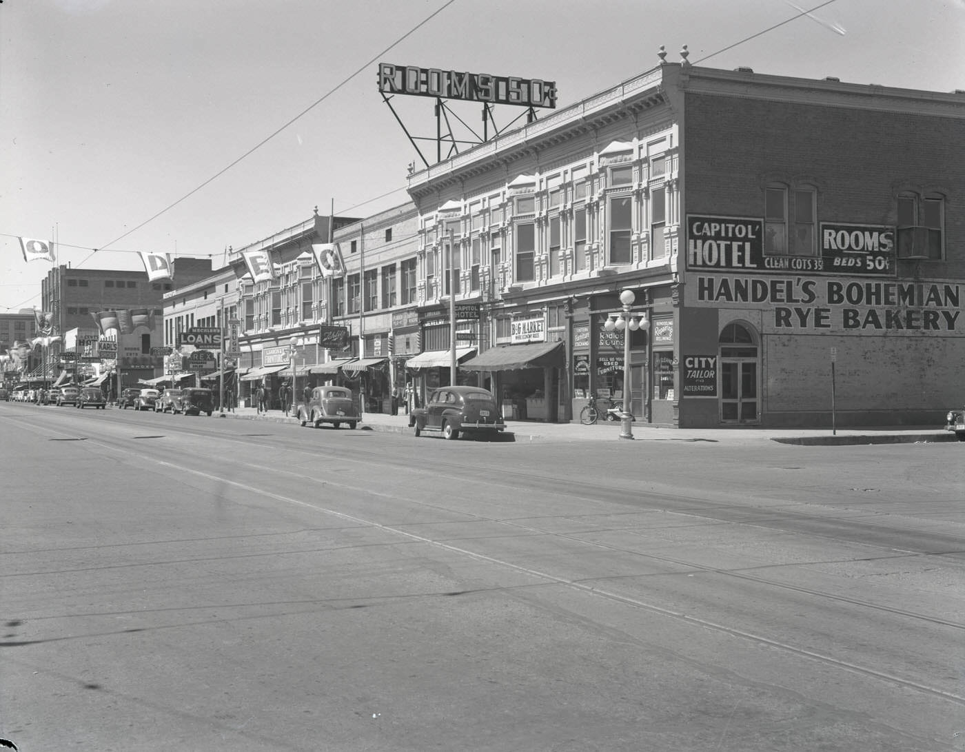 200 Block of E. Washington St., 1945. View looking west down E. Washington St. at the 200 block. Visible are Handel's Bohemian Rye Bakery (342 E. Washington) and the Capitol Hotel (242 E. Washington).