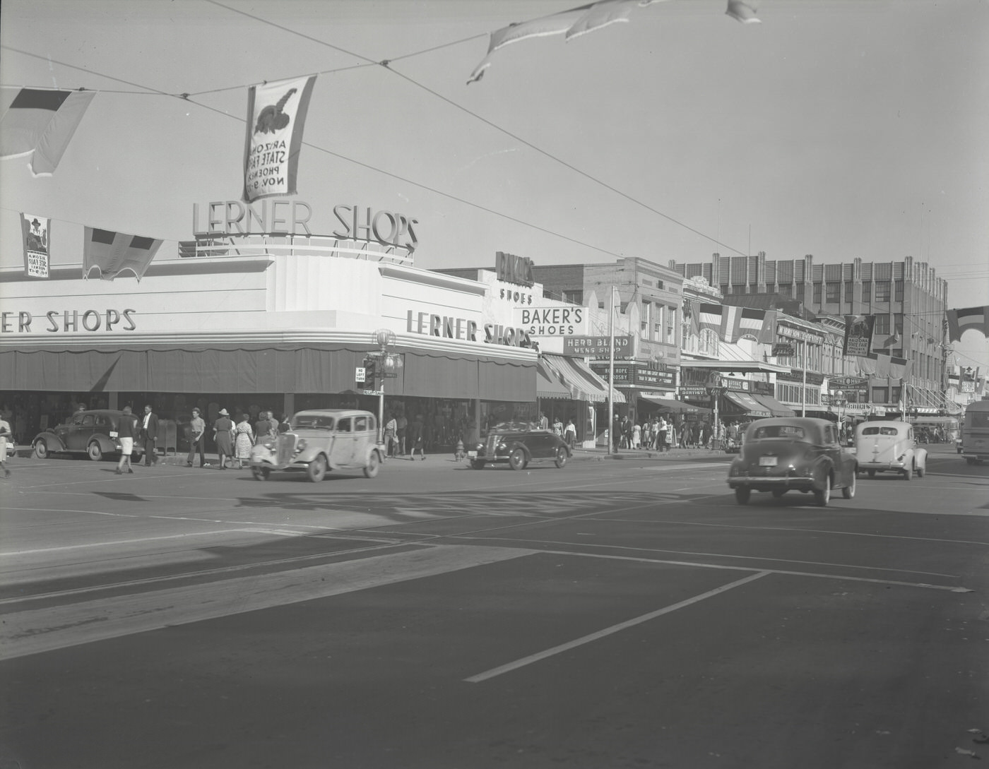 Intersection of Washington St. and Central Ave., 1945. View looking east. The Lerner Shops, including Baker's Shoe Store, are visible. The date assigned to this photograph is approximate.