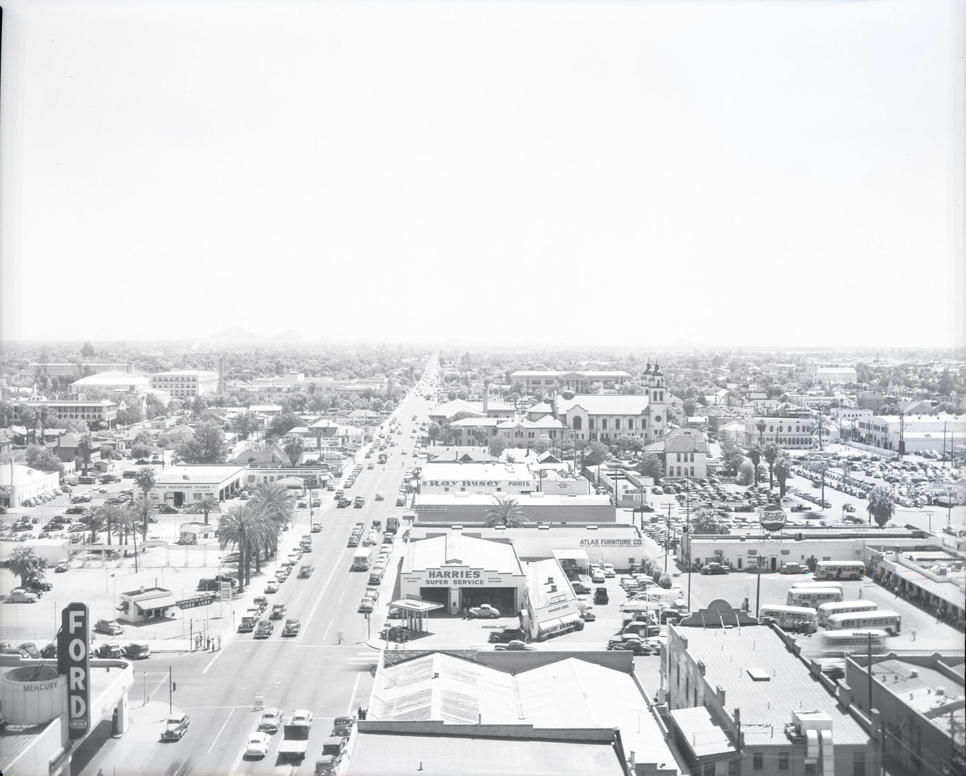 Cityscape of Downtown Phoenix, 1946. View looking east down E. Van Buren Street. Photographer is standing on a rooftop at approximately the intersection of Van Buren and Central. St. Mary's Basilica and portions of Monroe St. are visible