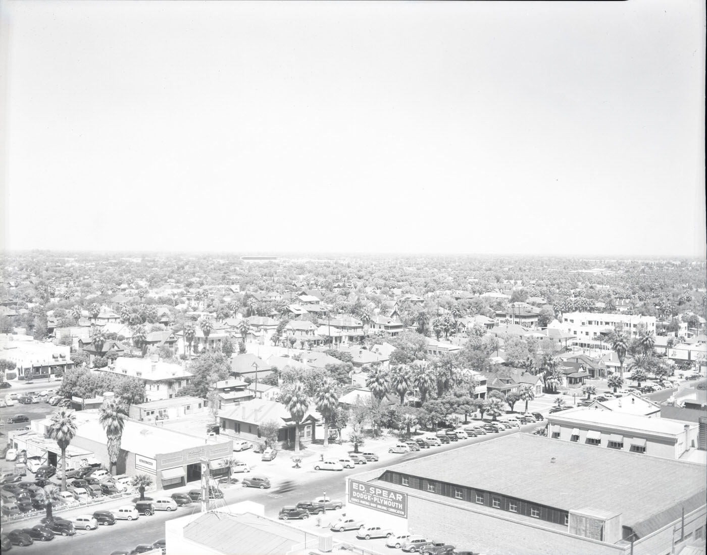 Cityscape of Phoenix, 1946. View looking south from the 300 block of N. 1st St. taken from a rooftop located at approximately the intersection of Central and Van Buren. Ed. Spear Dodge-Plymouth is visible.
