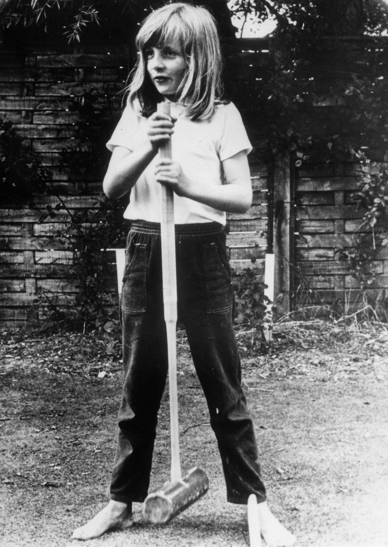 Lady Diana Spencer holding a croquet mallet during a game at Itchenor, West Sussex, 1970
