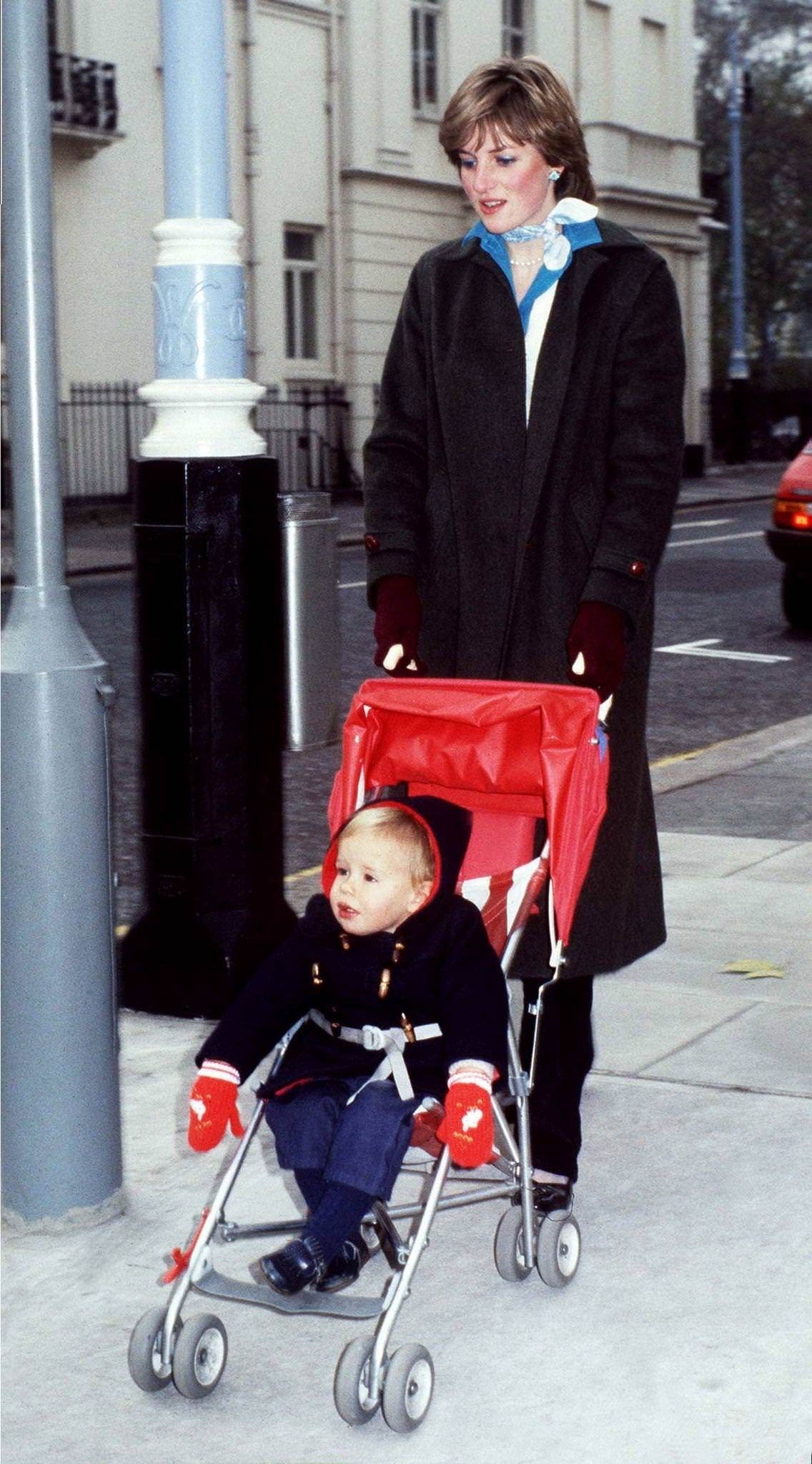 Lady Diana Spencer takes her young charge Patrick Robinson for his daily outing in the Eaton Square district of London during her time as a nanny, November 1980.