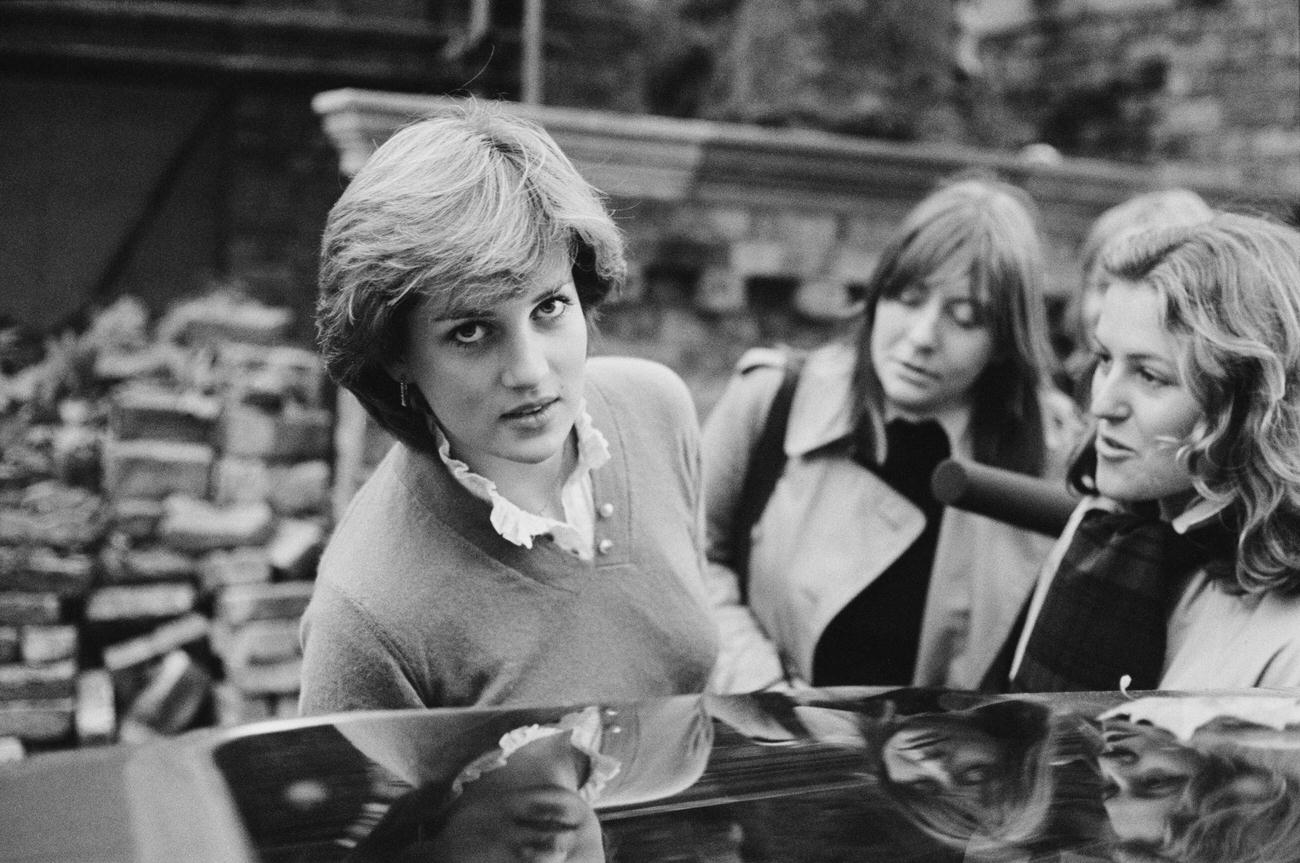 Nineteen year-old Lady Diana Spencer interviewed by the press while getting into a car, London, 1980