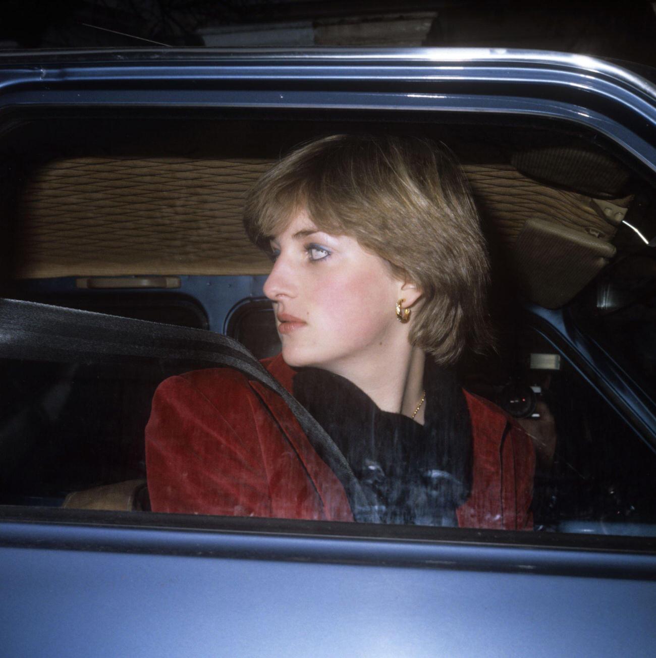 Lady Diana Spencer who has been linked romantically with the Prince of Wales, leaves her London flat in her car after being pursued by the media.