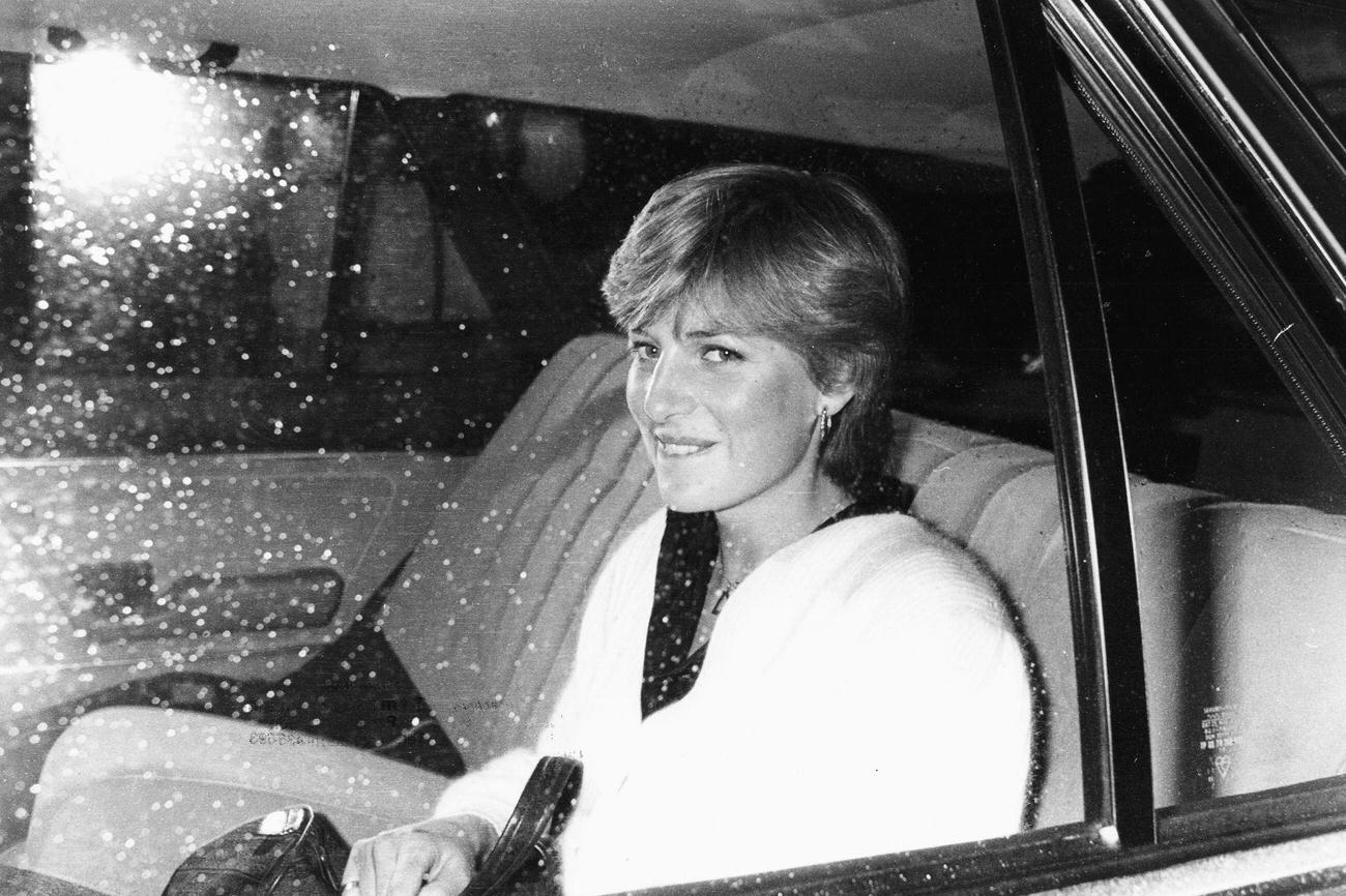 Lady Diana Spencer, fiance of Prince Charles, in the back of a car leaving her flat in London, February 1981.