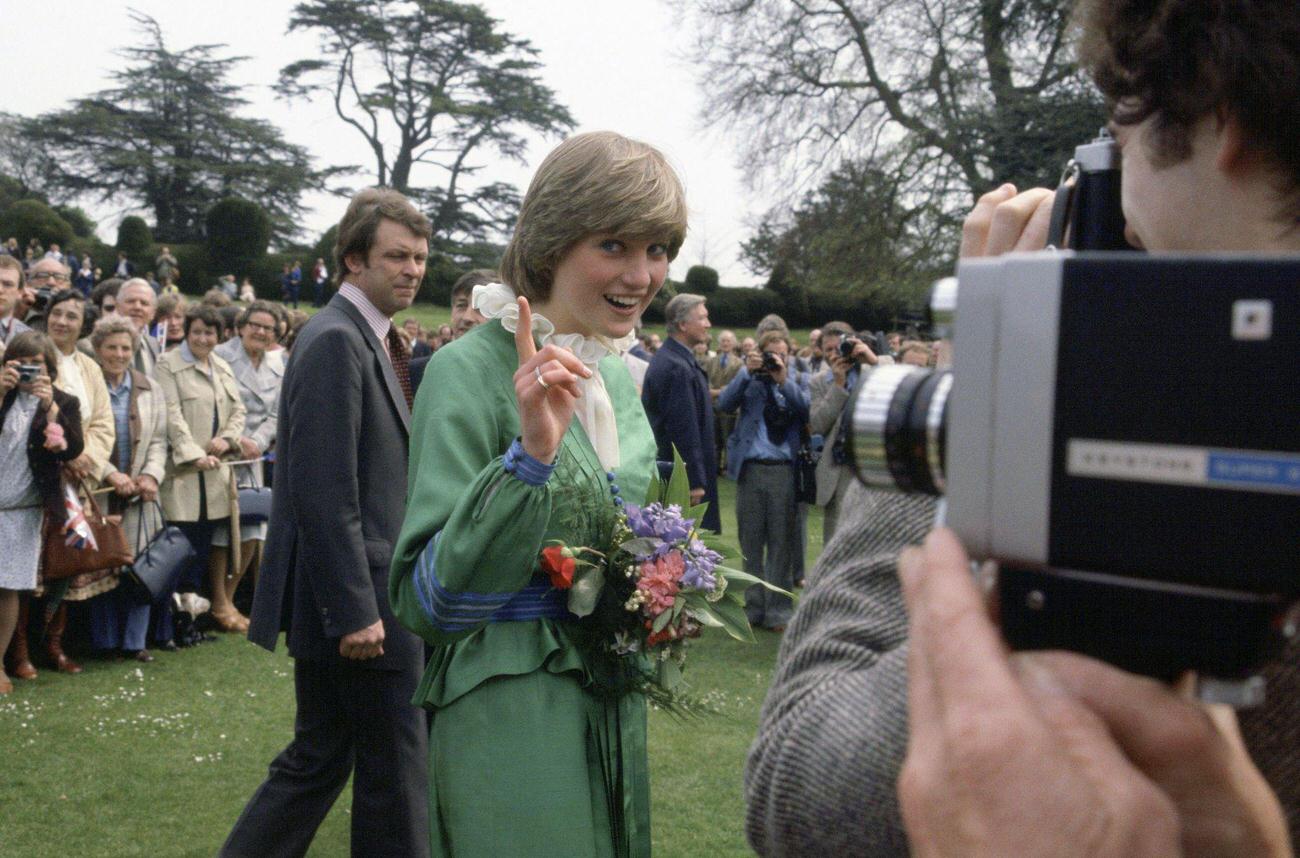 Lady Diana Spencer pointing her finger at photographers during a visit to broadlands the former home of Earl Mountbatten. Behind is royal police bodyguard Graham Smith