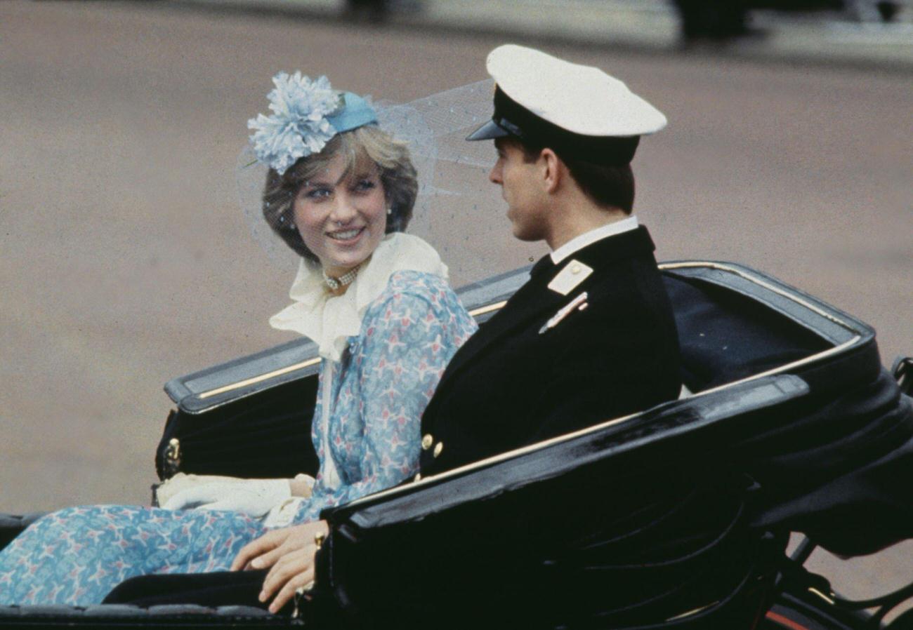 Lady Diana Spencer wearing a blue floral Bill Pashley outfit with a matching hat, and Prince Andrew in a carriage during the Trooping the Colour ceremony in London, England, 13th June 1981.