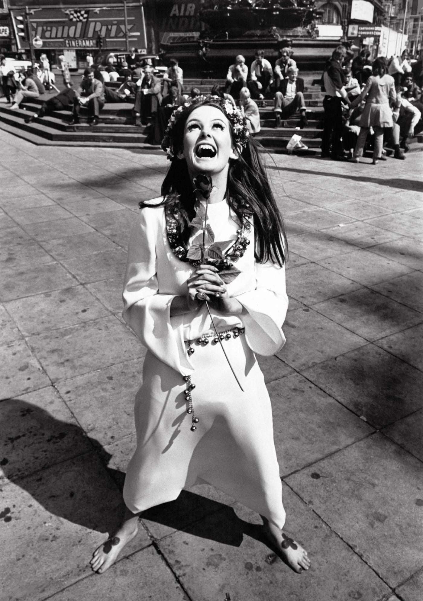 Model Lesley Hill wearing a 'Young's Dress Hire' hippie wedding dress with a flower crown in her hair at Piccadilly.