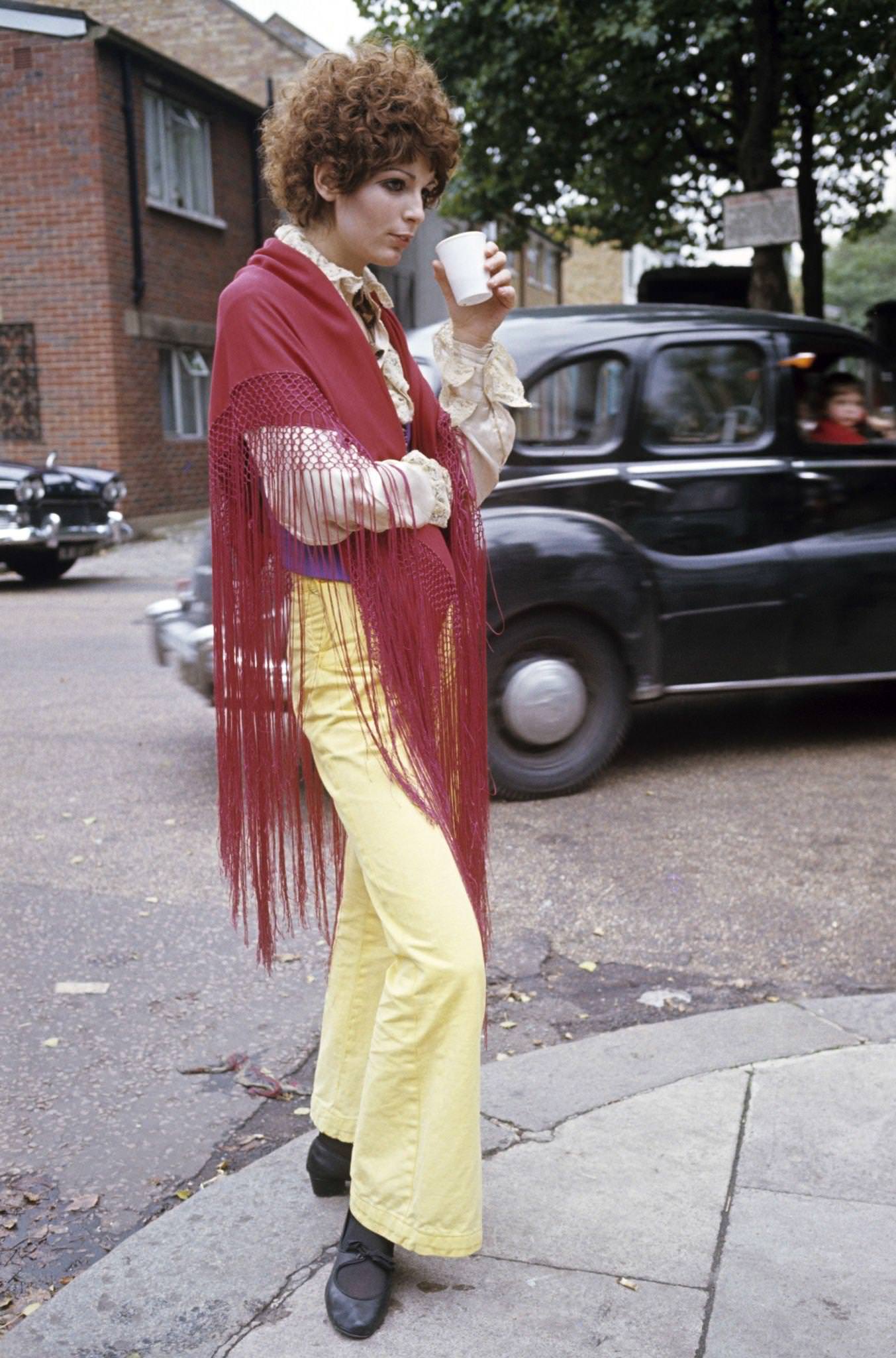 John Crittle Jane Birkin And John Crittle dressed in hippie fashion, 1967dressed in hippie fashion, a girl having a drink, wearing a shawl.