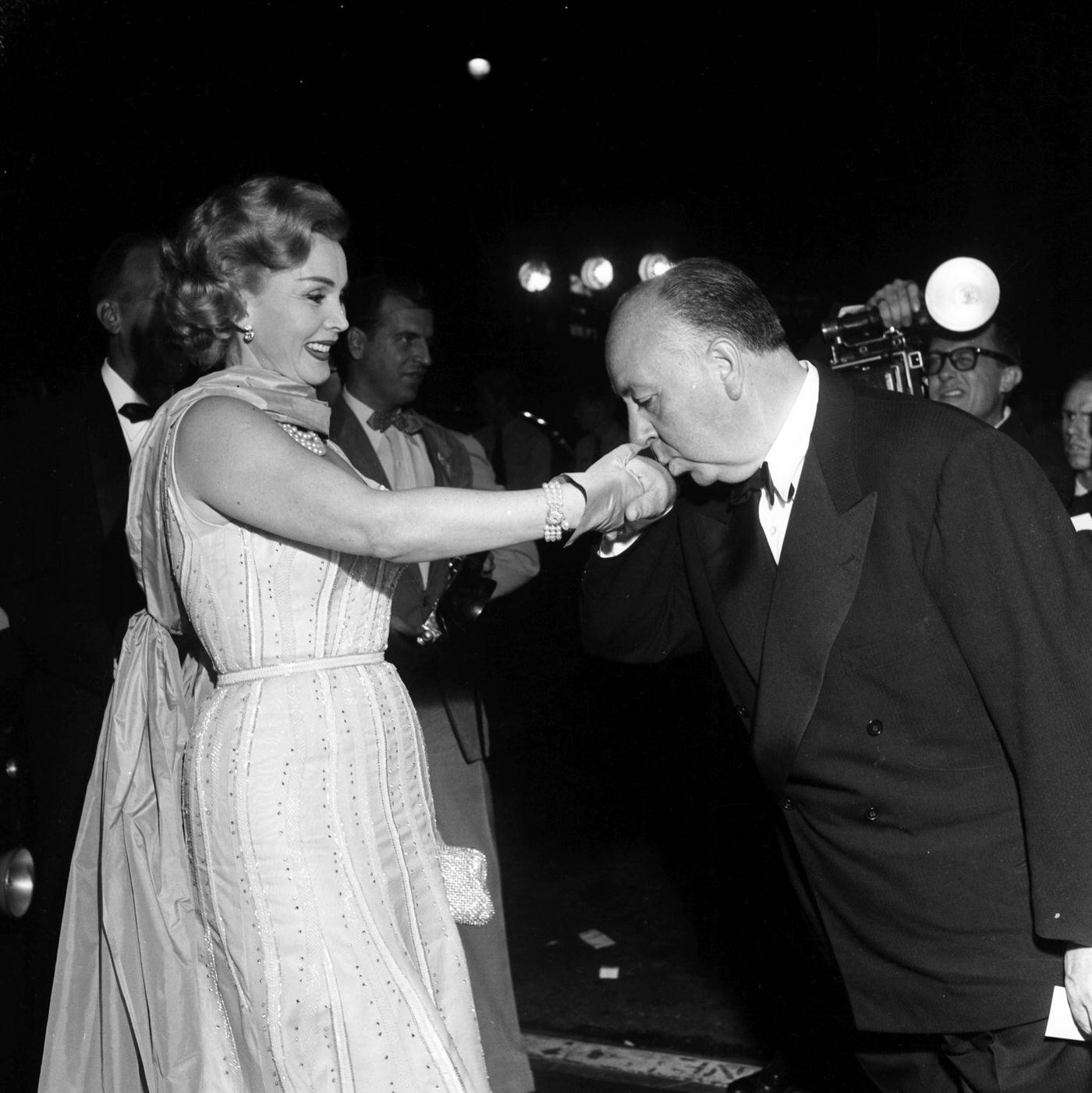 Director Alfred Hitchcock with guest at the premier of "Rear Window" in Los Angeles